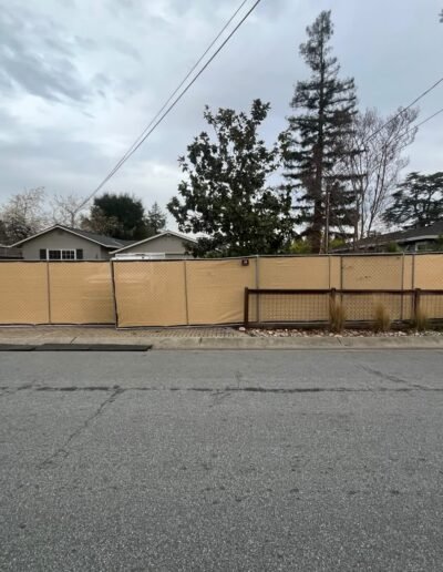 Temporary fence surrounding a residential lot